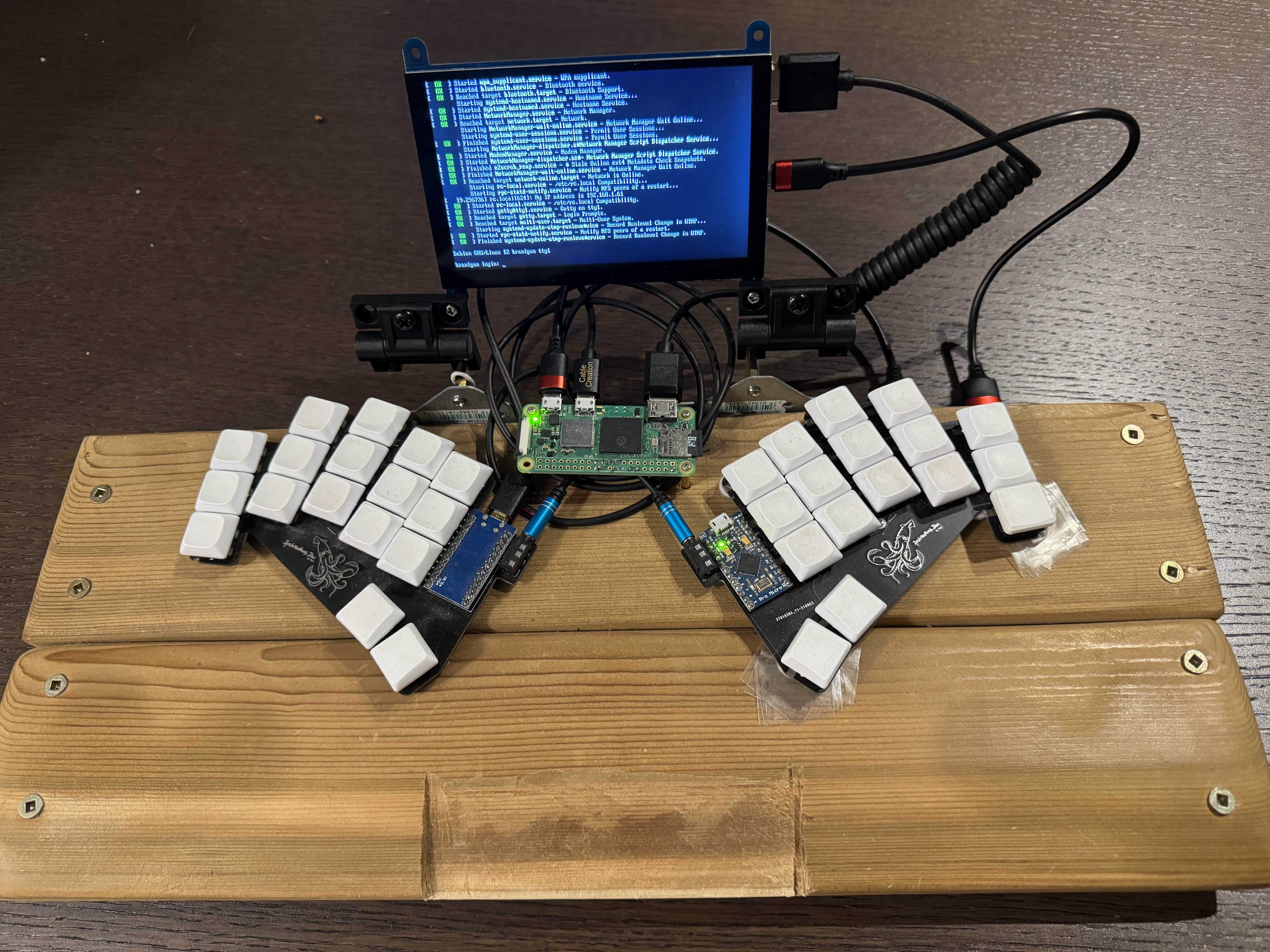 The writer deck from the front, open, turned on with the login screen showing.